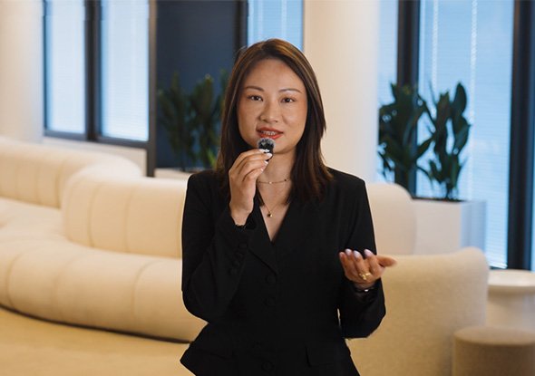 2026TravelRetail524244InterviewMaggie Liu speaking into a microphone in a lounge