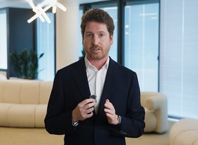 2026TravelRetail524247InterviewThomas Drevet speaking into a microphone in a lounge