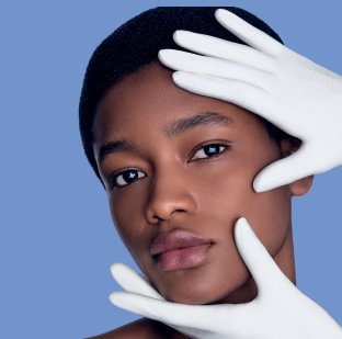 2026 dermatological beauty division black woman examining her face skin herobanner mobile