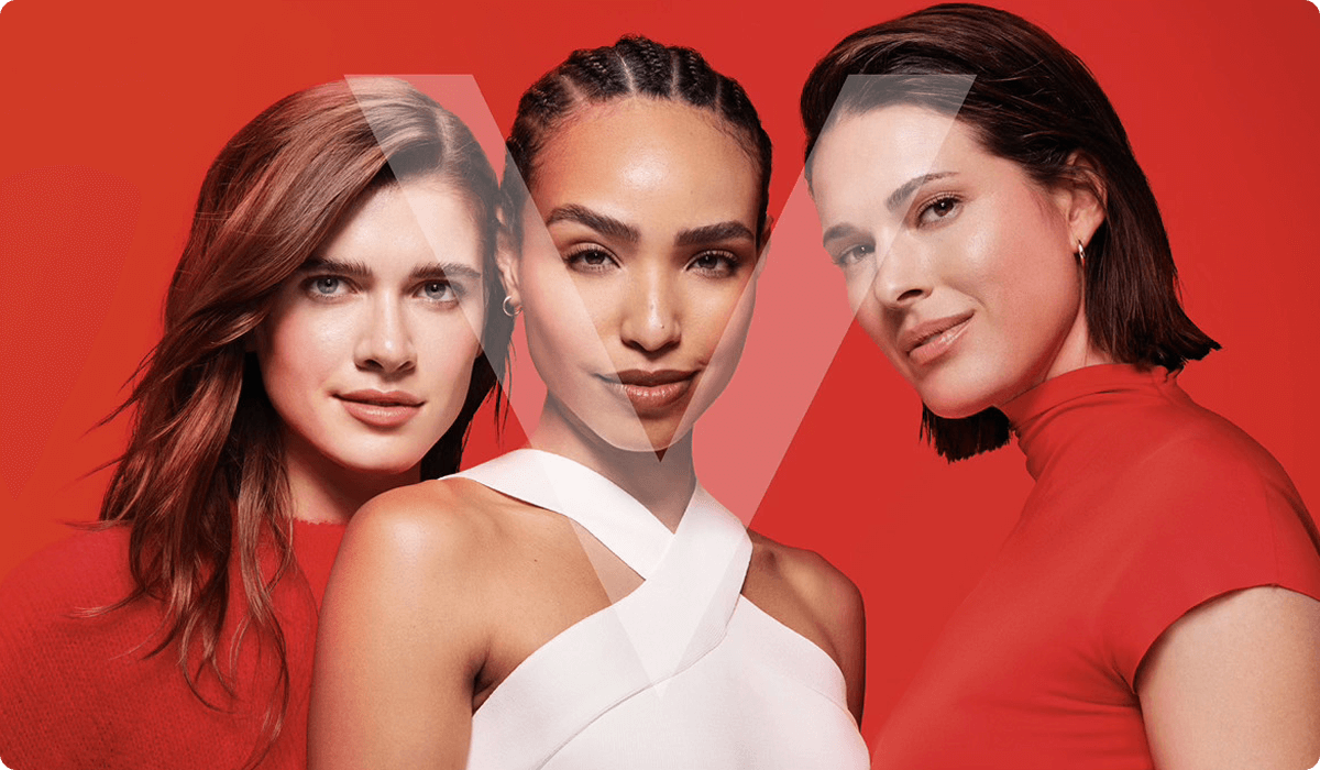 2025 vichy luxe brand three women posing together in red and white dress
