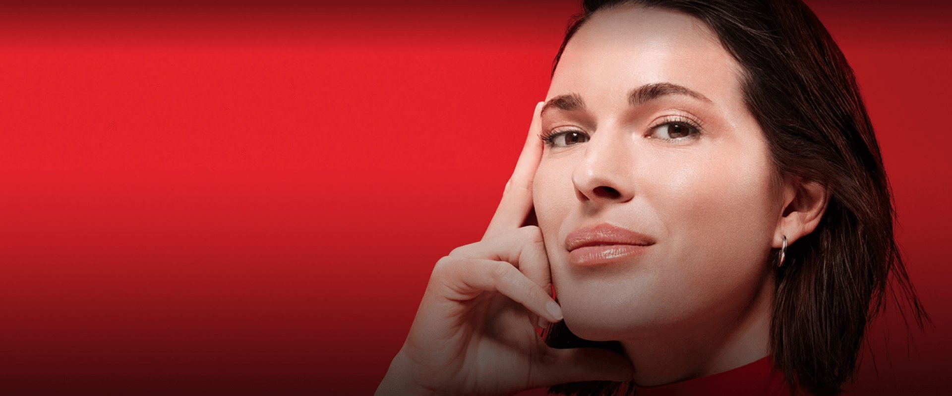 2025 vichy luxe brand woman brown hair hands on her face posing hero banner