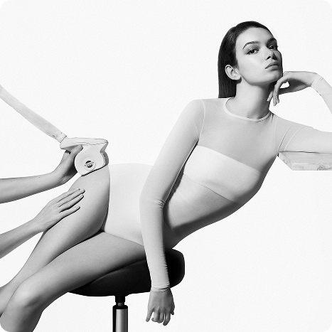 2025 loreal luxe brand carita woman in white bodysuit sitting on a stool