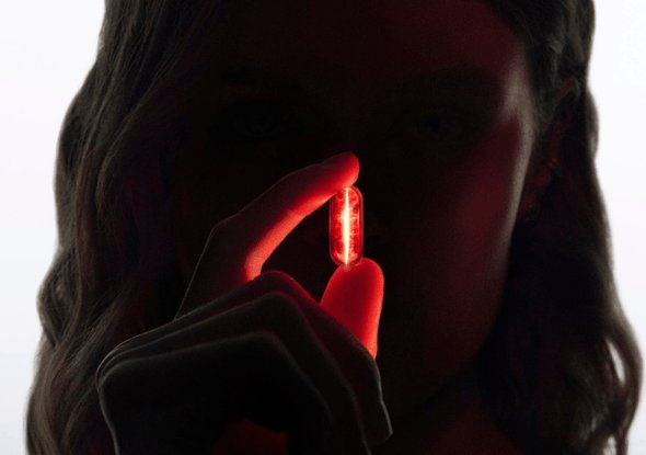 2026 luxe division woman holding red led longevity visual