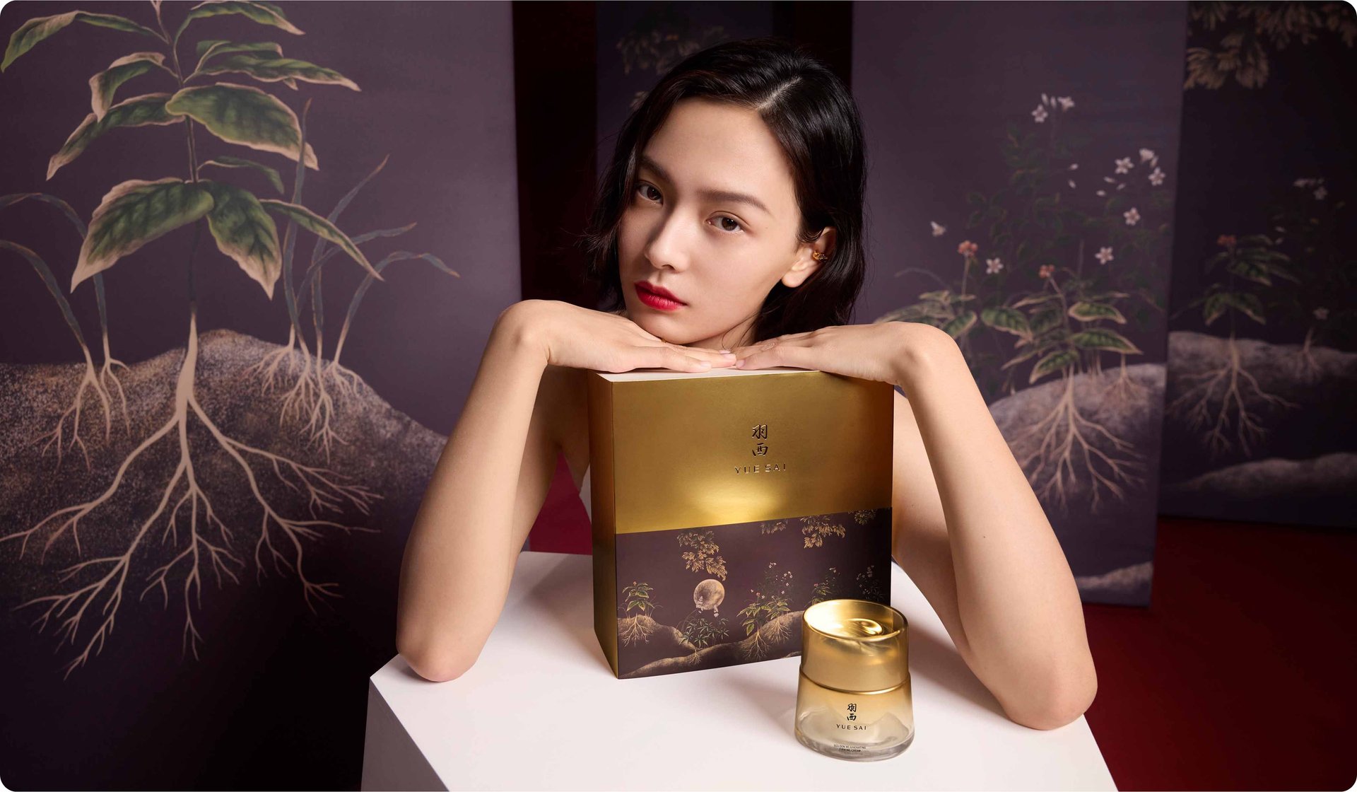 2026 loreal luxe brand yuesai woman with short black hair and red lipstick holding yuesai box