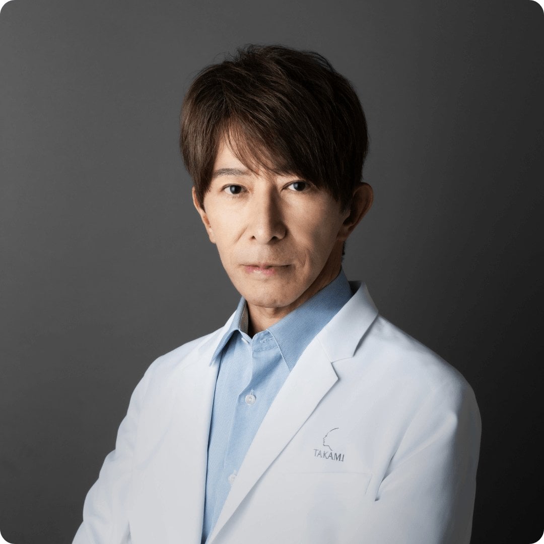 2026Takami000000PresidentManifestoDr Hiroshi Takami wearing white lab coat arms crossed  dark grey b