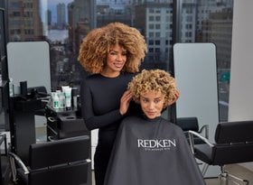 2026 professional products division women with brown curly hair styling