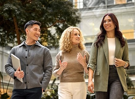 2026 Careers Website Card Two women  a man walking in Loreal Campus with laptops